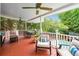 Relaxing outdoor deck featuring comfortable seating and lush, private backyard views at 650 Garden Wilde Pl, Roswell, GA 30075