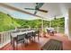 Spacious covered deck with outdoor dining area and comfortable lounge seating at 650 Garden Wilde Pl, Roswell, GA 30075
