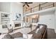 Bright living room features hardwood floors and large windows with plenty of natural light at 650 Garden Wilde Pl, Roswell, GA 30075