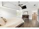 Spacious main bedroom suite featuring a tray ceiling, hardwood floors and an abundance of natural light at 650 Garden Wilde Pl, Roswell, GA 30075