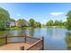 Scenic view of the community pond and water feature in a lush setting at 650 Garden Wilde Pl, Roswell, GA 30075