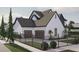 Two-story home with a three-car garage, dark gray roof, and modern curb appeal at 13375 Fincher Rd, Canton, GA 30114