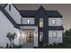 Modern two-story home featuring a stone facade, dark accents, and a well-manicured front yard at 13375 Fincher Rd, Canton, GA 30114