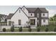 Beautiful two-story home with modern design and well-manicured front yard at 13375 Fincher Rd, Canton, GA 30114