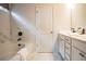 Bathroom showcases a soaking tub with marble tile surround, vanity with dual sinks, and modern fixtures at 2038 Brookhill Way Lot 6, Snellville, GA 30078