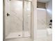 Elegant bathroom showcasing a walk-in shower with glass doors and a relaxing soaking tub at 2038 Brookhill Way Lot 6, Snellville, GA 30078