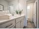 Bright bathroom with double sinks, white cabinets, and a separate shower room at 2038 Brookhill Way Lot 6, Snellville, GA 30078