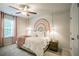 Warm and inviting bedroom featuring a rainbow mural, ceiling fan, and bedside lighting at 2038 Brookhill Way Lot 6, Snellville, GA 30078