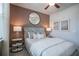 Modern bedroom with a unique accent wall, stylish decor, and comfortable lighting at 2038 Brookhill Way Lot 6, Snellville, GA 30078