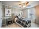 Stylish bedroom with football themed art, ceiling fan, and a cozy bed at 2038 Brookhill Way Lot 6, Snellville, GA 30078