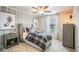 Inviting bedroom decorated with neutral colors, two football art pieces, and ceiling fan at 2038 Brookhill Way Lot 6, Snellville, GA 30078