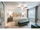 Bright bedroom featuring a large bed, a ceiling fan, and a window, creating a cozy atmosphere at 2038 Brookhill Way Lot 6, Snellville, GA 30078