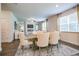Bright dining room with elegant chairs, fireplace, large windows, and neutral décor for gatherings at 2038 Brookhill Way Lot 6, Snellville, GA 30078