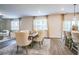 Open-concept dining area with large windows, stylish furniture, and modern light fixtures at 2038 Brookhill Way Lot 6, Snellville, GA 30078