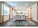 Inviting dining area with modern table, view of the kitchen, and ample natural light at 2038 Brookhill Way Lot 6, Snellville, GA 30078