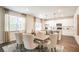 Open-concept dining area with a view into the kitchen, with large windows for natural light at 2038 Brookhill Way Lot 6, Snellville, GA 30078
