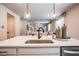 Modern kitchen island featuring quartz countertop, sink, faucet, and pendant lighting in an open layout at 2038 Brookhill Way Lot 6, Snellville, GA 30078
