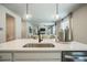 Modern kitchen features an island with quartz countertops, pendant lighting, and stainless steel appliances at 2038 Brookhill Way Lot 6, Snellville, GA 30078