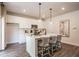 Bright kitchen with a large island, white cabinets, stainless steel appliances, and ample counter space at 2038 Brookhill Way Lot 6, Snellville, GA 30078