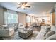 Spacious living room with open layout, comfortable seating, and view of the modern kitchen at 2038 Brookhill Way Lot 6, Snellville, GA 30078