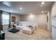 Spacious living room features neutral colors, plush furniture, and modern decor at 2038 Brookhill Way Lot 6, Snellville, GA 30078