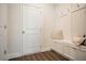Bright mudroom with built-in bench seating, storage cabinets, and coat hooks for organization at 2038 Brookhill Way Lot 6, Snellville, GA 30078