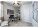 Bright home office with a modern desk, shelving, and a comfortable sofa at 2038 Brookhill Way Lot 6, Snellville, GA 30078