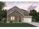 Charming two-story brick home with a manicured lawn, a two-car garage, and a welcoming front porch at 2038 Brookhill Way Lot 6, Snellville, GA 30078