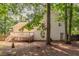 A view of the back of the home featuring an elevated deck and fenced yard at 962 Taylors Farm Ct, Canton, GA 30115