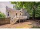 Two-story home featuring a wood deck, rear entry and fenced backyard at 962 Taylors Farm Ct, Canton, GA 30115