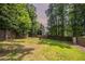 Spacious, grassy backyard fully enclosed with a wood privacy fence at 962 Taylors Farm Ct, Canton, GA 30115
