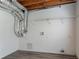Unfinished storage space with wood-look vinyl floors and exposed utilities at 962 Taylors Farm Ct, Canton, GA 30115