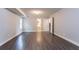 View of the finished basement featuring wood floor, neutral paint and access to a bathroom at 962 Taylors Farm Ct, Canton, GA 30115