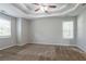 Spacious bedroom features large windows, plush carpeting, and a ceiling fan at 962 Taylors Farm Ct, Canton, GA 30115
