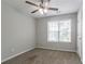 Simple bedroom with a ceiling fan and window with blinds at 962 Taylors Farm Ct, Canton, GA 30115
