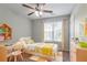 Bright ' bedroom with a sunny window, desk and colorful decor at 962 Taylors Farm Ct, Canton, GA 30115