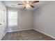 Cozy bedroom with carpet flooring and ample natural light from the window at 962 Taylors Farm Ct, Canton, GA 30115