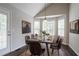 Dining area featuring laminate floors, bay windows and dining room set at 962 Taylors Farm Ct, Canton, GA 30115