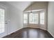 Bright dining area featuring laminate floors and large bay windows at 962 Taylors Farm Ct, Canton, GA 30115