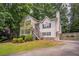 Charming two-story home with front yard landscaping, stone accents and driveway at 962 Taylors Farm Ct, Canton, GA 30115