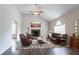 Living room with vaulted ceilings, fireplace, hardwood floors and furniture at 962 Taylors Farm Ct, Canton, GA 30115