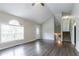 Open living area with high ceilings, wood floors, and a large window at 962 Taylors Farm Ct, Canton, GA 30115