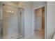 Walk-in shower with glass doors and tile surround next to walk-in closet at 316 Moab Ct, Stockbridge, GA 30281