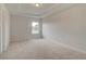 This bedroom features neutral walls, carpet, and a window to let in natural light at 316 Moab Ct, Stockbridge, GA 30281