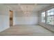 Elegant dining room featuring coffered ceilings, wainscoting, and large windows at 316 Moab Ct, Stockbridge, GA 30281
