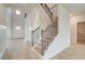 Open and airy foyer with staircase, light wood floors, and natural light at 316 Moab Ct, Stockbridge, GA 30281