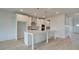 Well-lit open kitchen with a central island, ideal for entertaining and culinary creations at 316 Moab Ct, Stockbridge, GA 30281