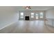 Bright living room with fireplace, hardwood floors, and a view to the outdoors at 316 Moab Ct, Stockbridge, GA 30281