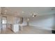 Bright, open-concept living room and kitchen with hardwood floors and modern finishes at 316 Moab Ct, Stockbridge, GA 30281