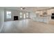 Open-concept living room and kitchen with fireplace and ample natural light at 316 Moab Ct, Stockbridge, GA 30281